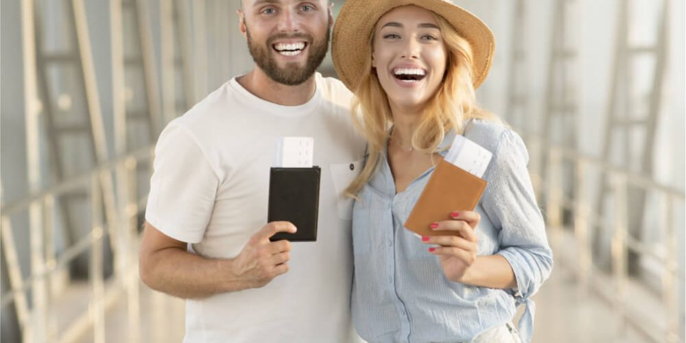 happy-couple-with-passports-and-tickets-at-airport-2021-08-30-02-08-49-utc-1.jpg